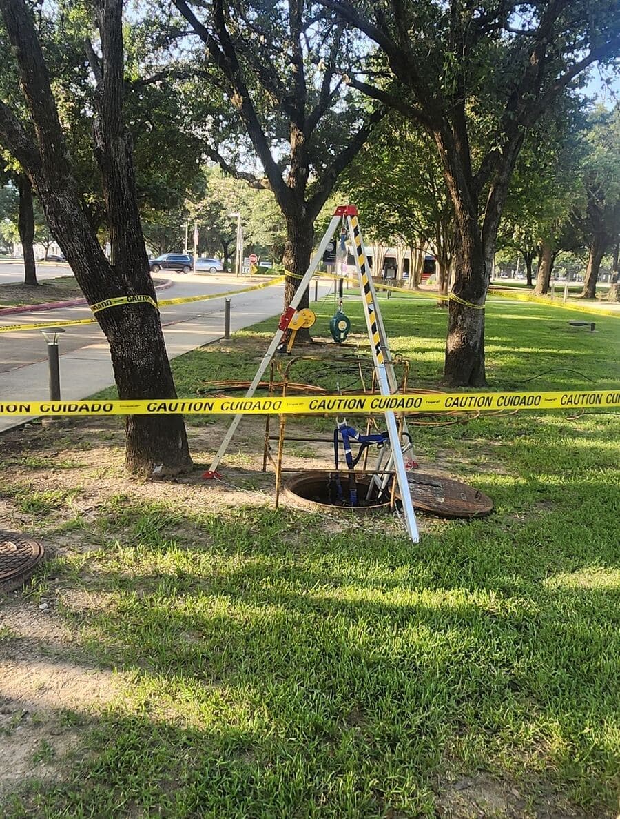 Fiber crew accessing an underground vault